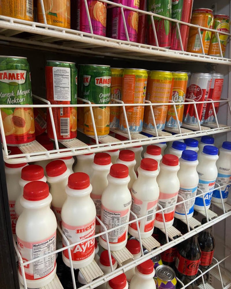 Cooler stocked with drinks and dairy products
