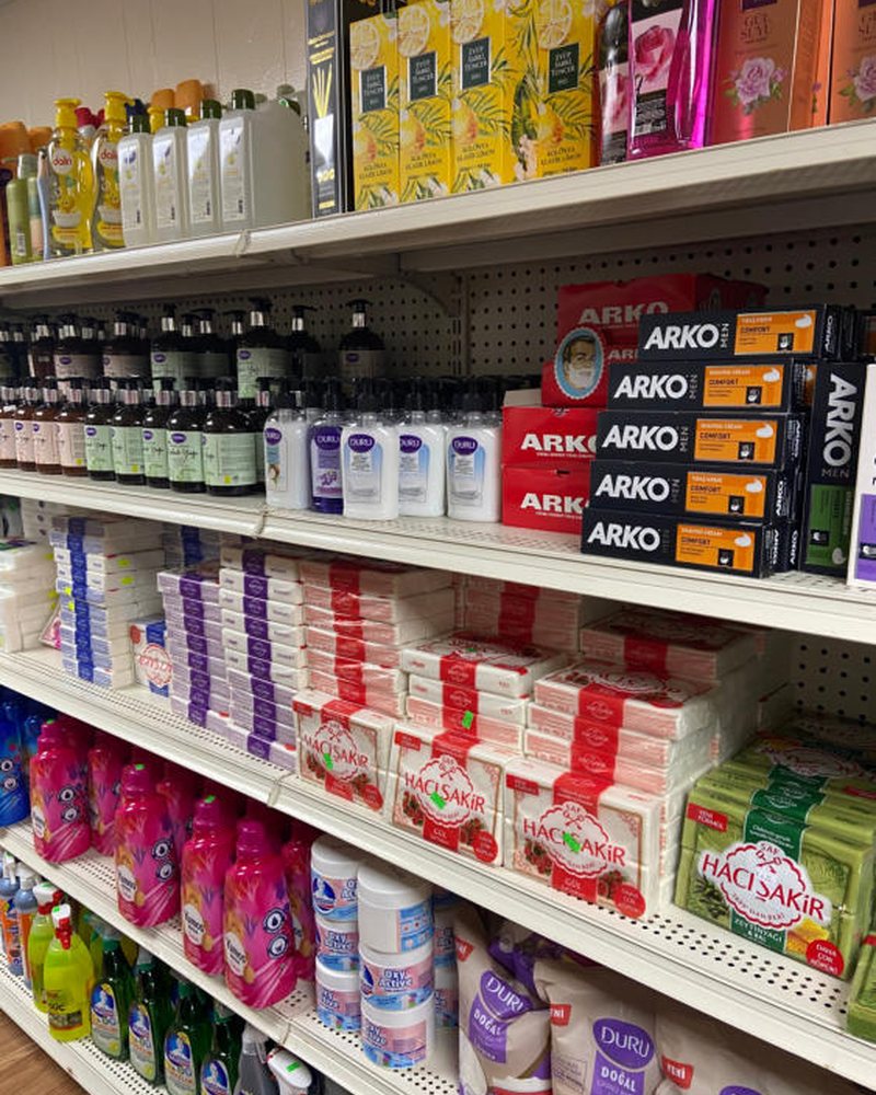 Shelf of soaps, shampoos and household products