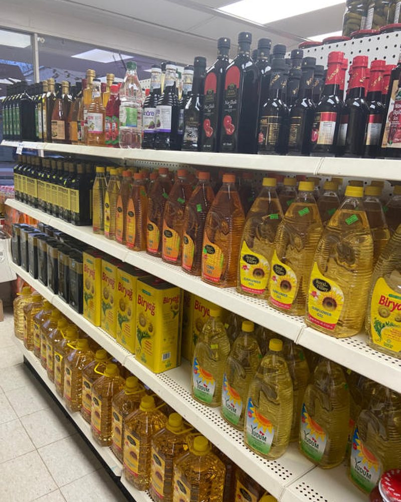 Shelves of olives, pickles and jarred goods